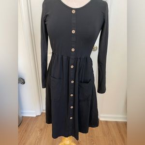 Woman’s black long sleeve dress